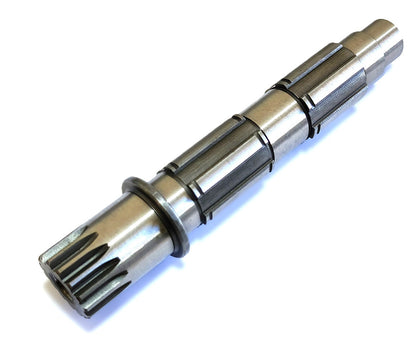 A precision-machined aftermarket KTM countershaft made from case-hardened steel, displaying the gear teeth and body of the shaft.